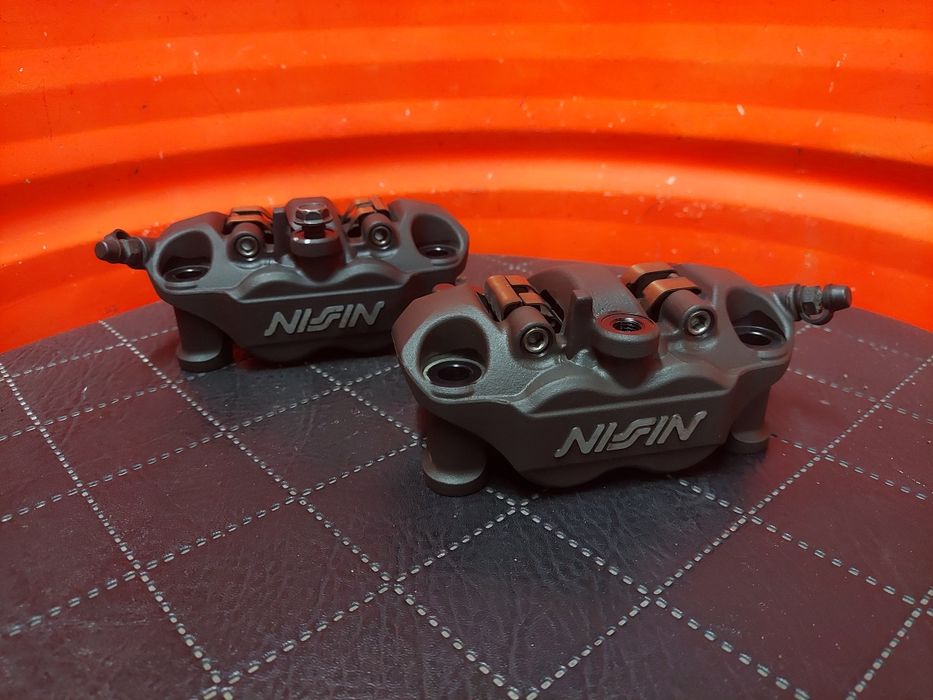 Jak NOWE Zaciski Kawasaki Ninja zx-6r 2019-2025 zx-10r z1000 z750 zacisk prawy lewy Hamulec przód przedni Nissin Brembo zx6r zx10r