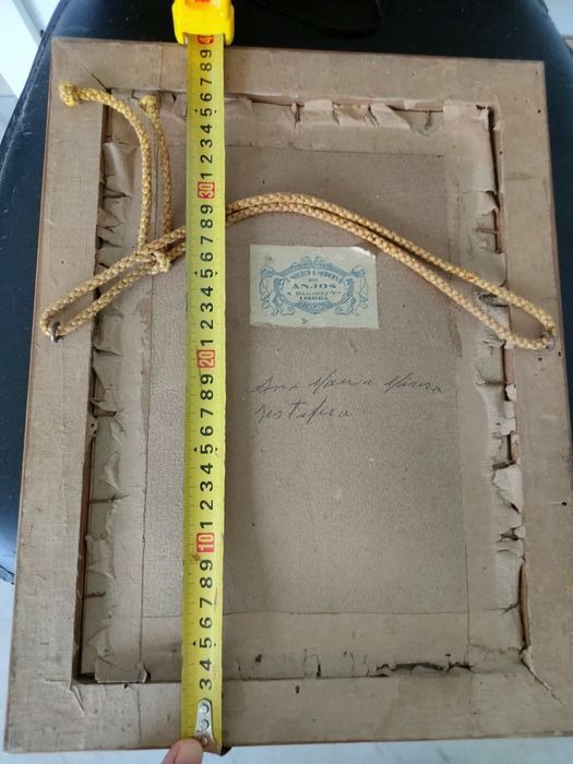 Moldura antiga com imagem da "Imaculada Conceição".