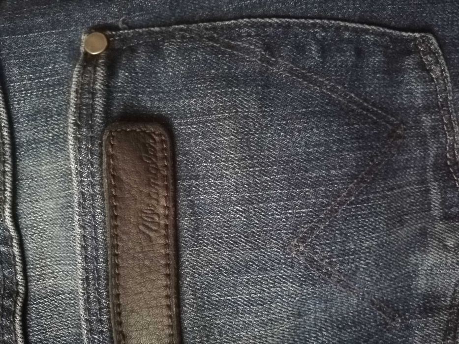 Jeansy Wrangler W28L34