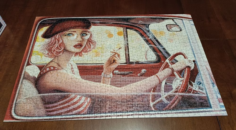 Puzzle 1000 Kobieta w aucie