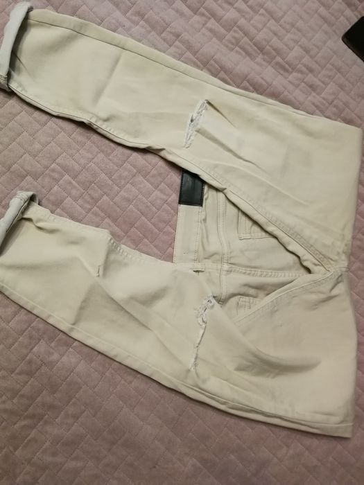 Spodnie rurki z dziurami rozm. 42