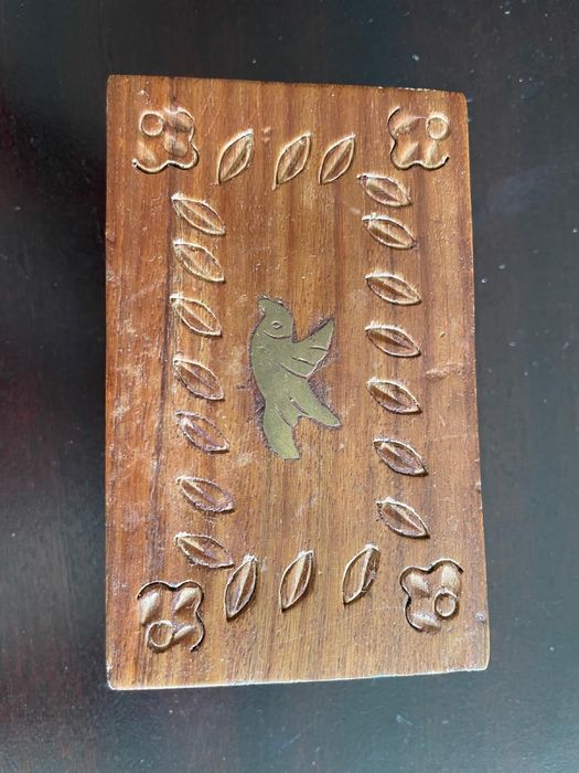 Wooden box with carved lid