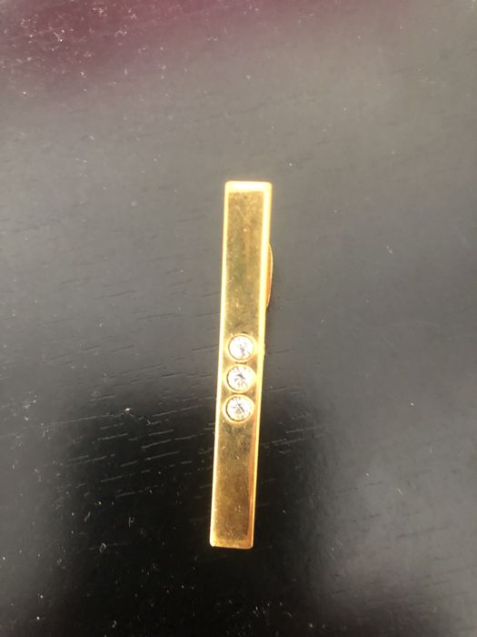 Clip de gravata dourado