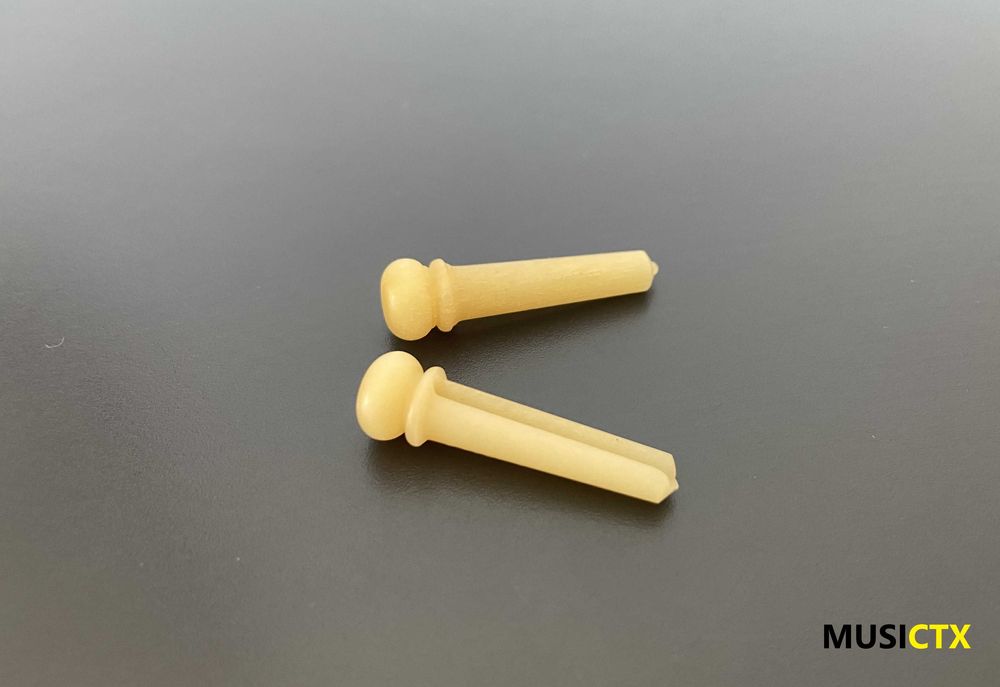 Pins em osso para guitarra folk