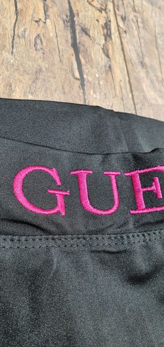 Czarne legginsy damskie premium logo neon M