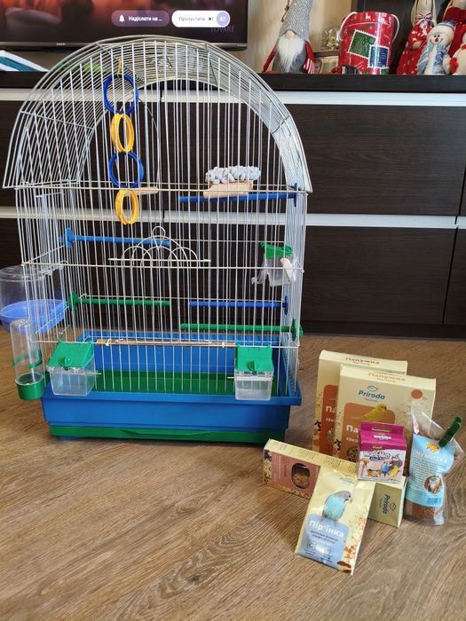 Продам клітку для папужки з усім наповненням та кормами