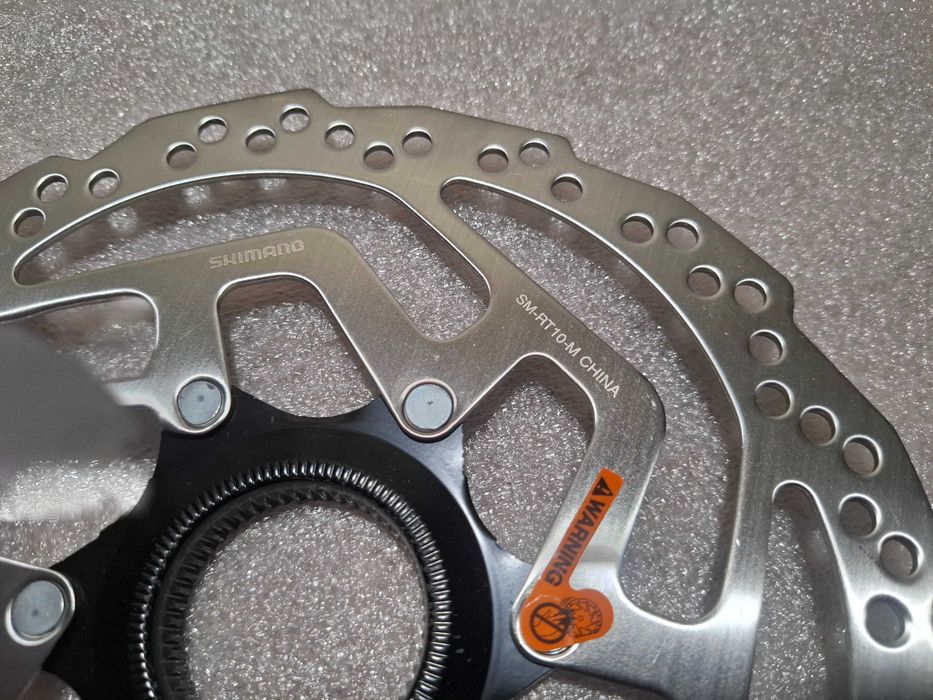 Tarcza Hamulca Rowerowego Shimano SM-RT10 180 Nowa Centerlock Nakrętka