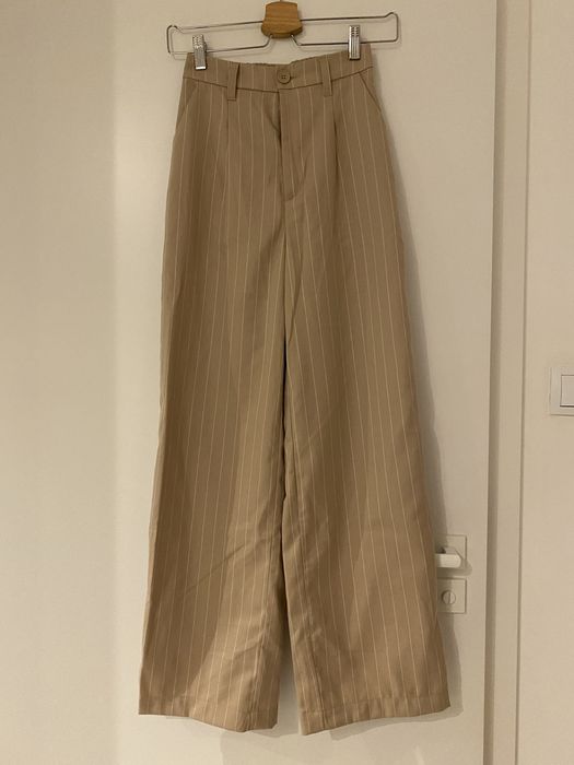 Spodnie H&M w paski z wysokim stanem. Rozszerzana nogawka. Jak nowa!