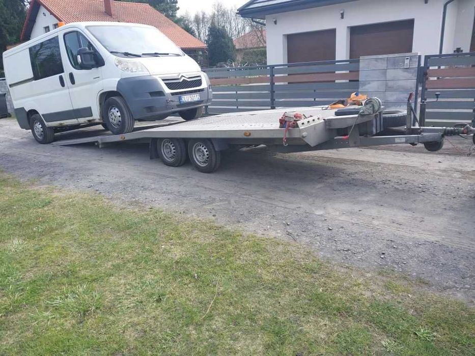 Wynajem lawety przyczepy auto pomoc drogowa wypozyczenie holowanie laweta transport Jelenia Gora Polska EU