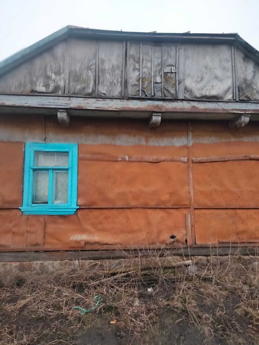 Земельна ділянка з будинком та прибудовами