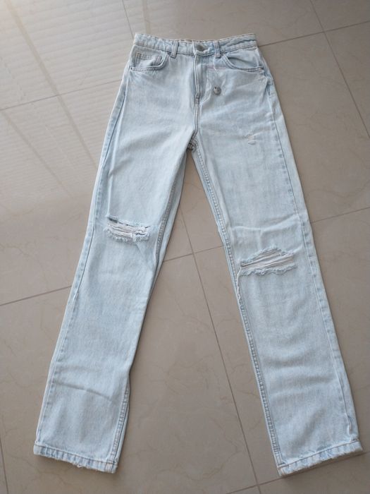 Nowe spodnie jeansowe z dziurami XS