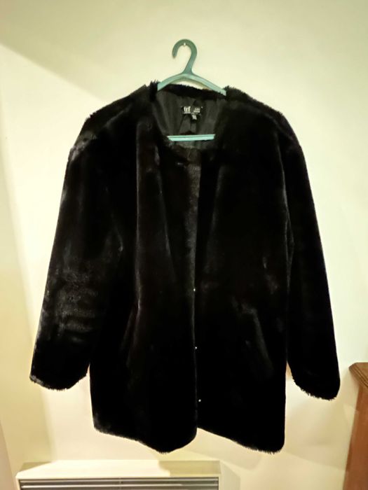 Casaco de pelo preto