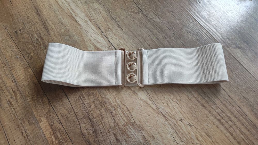 Szeroki pasek gorsetowy beżowy złota klamra elastyczny M L do sukienek