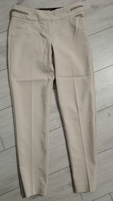 Eleganckie beżowe damskie spodnie Orsay