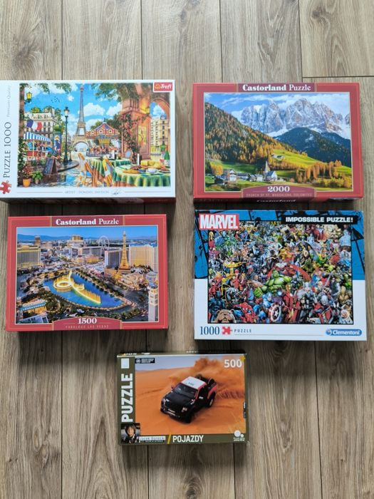 5 pudełek puzzli plus cztery antyramy do nich