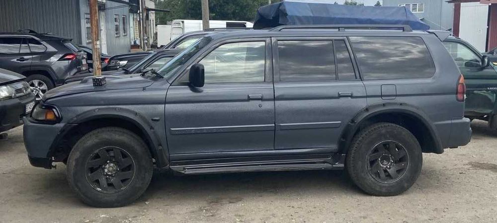 Расширители колесных арок Мітсубісі Паджеро Спорт 1й/перший Накладки на арки Розширювачі колісних арок Mitsubishi Pajero Sport 1998-2008 год