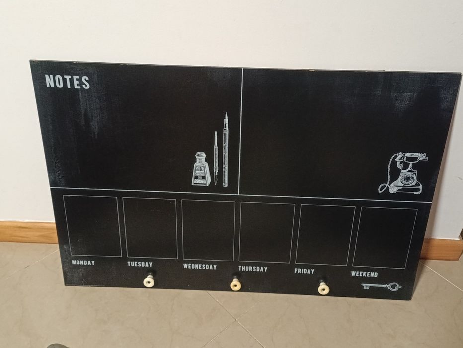 Blackboard with hooks.