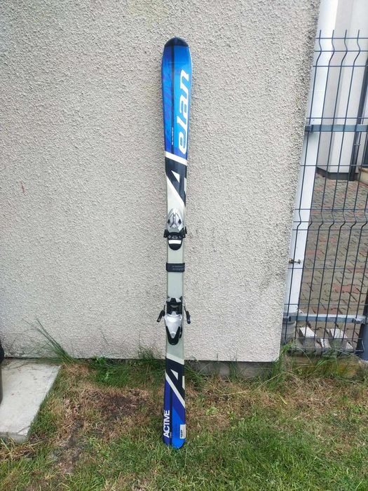 Używane narty męskie Elan 160 cm + kijki 120 cm