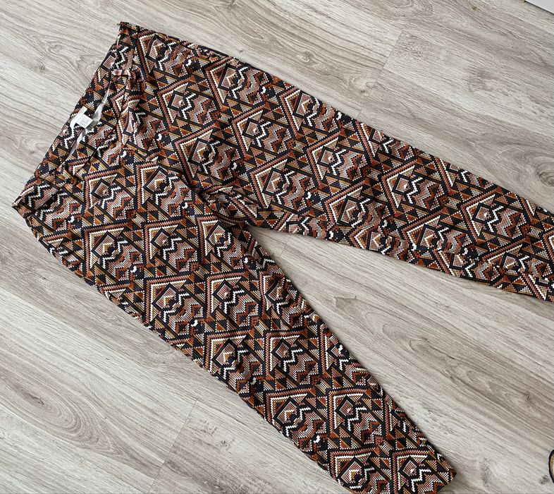 Wzorzyste spodnie H&M aztecki wzór brąz pomarańcz 42 xl jak nowe