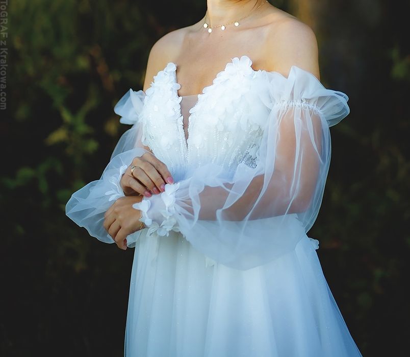 Suknia ślubna z rękawami