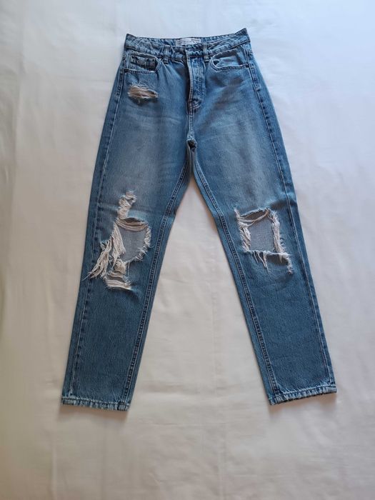 Calças de ganga rasgadas