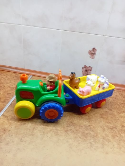 Музичний трактор з причепом. Фермер.Розвиваюча іграшка