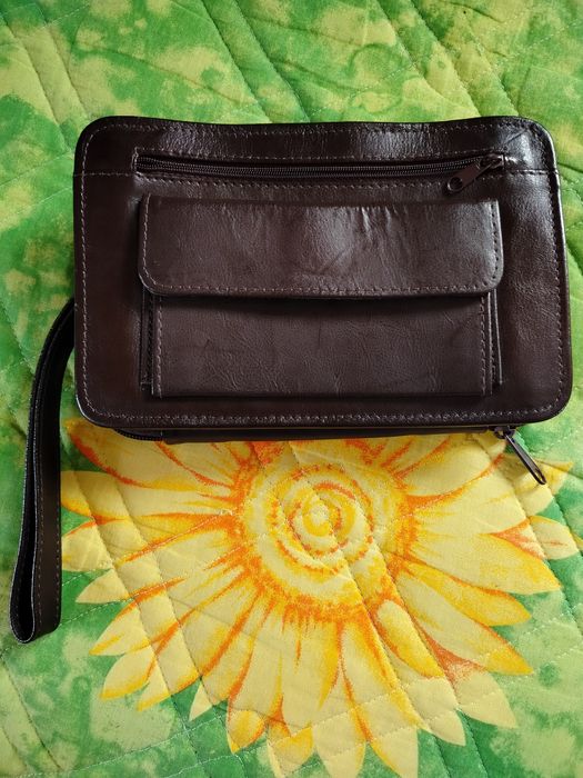 Męska brązowa saszetka ze skóry naturalnej do ręki