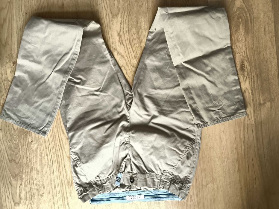 Kremowe eleganckie spodnie chłopięce Lindex, rozmiar 164