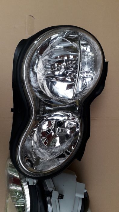 MERCEDES C KLASA W203 lift 2005 - lampa przednia lewa nowa idealna