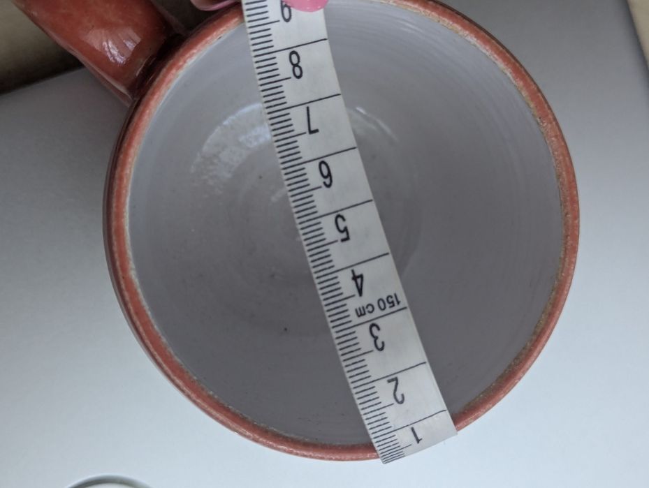 Nowy, ceramiczny kubek z uchem