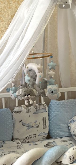 Музичний мобіль в дитяче ліжко