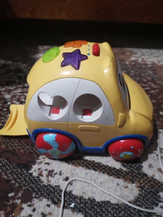 Детская машинка с глазками с грузовых открывающимися отсеком.