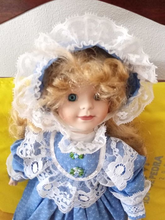 Boneca de porcelana64751960704770121