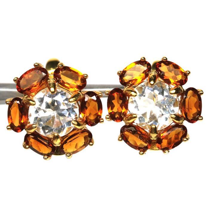 Серьги из серебра 925 пробы с белым топазом и коричневым турмалином.