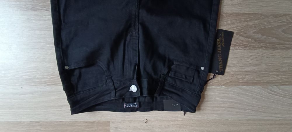 Nowe spodnie czarne z perełkami i z kokardką Trang jeans r. L