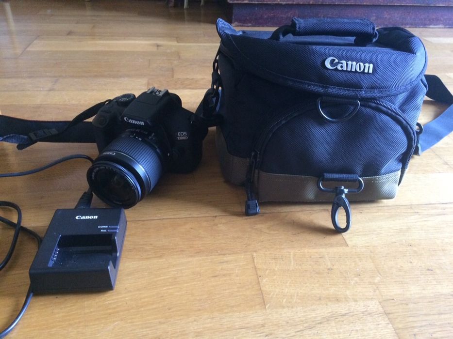 Canon 1300D com lente 18-55 mm, carregador e bolsa