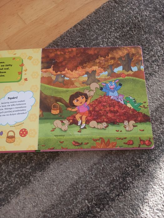 Dora poznaje świat - książka z puzzlami