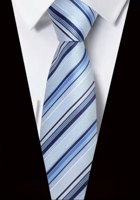 Klasyczna elegancja w nowoczesnym wydaniu - krawat w paski ze spinką