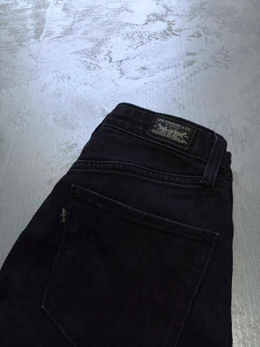 Damskie spodnie Levis W25 L30 XS