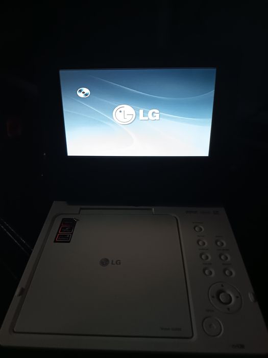 DVD portátil para venda a funcionar com os acessórios e mala LG
