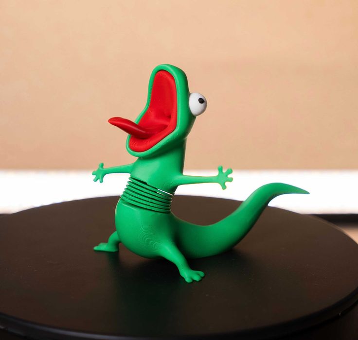 Рухома іграшка ящірка Том на пружині з мультфільму Хопперс. 3D-Іграшка Lizard Tom.