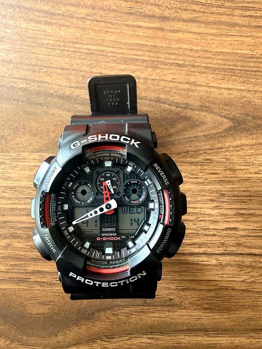 Casio G-Shock GA-100 preto e vermelho a funcionar a 100%