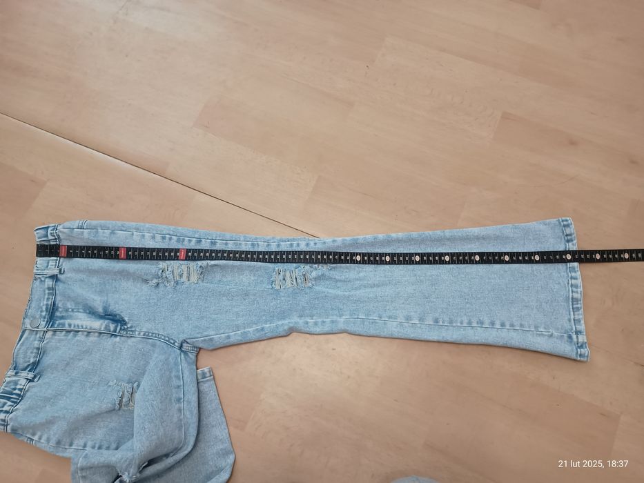 Spodnie dzwony z dziurami rozciągliwe dla dziewczynki rozm. 150