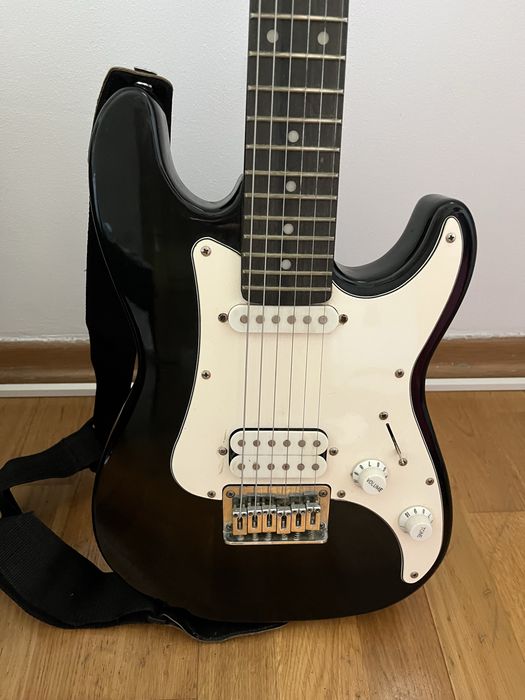 Guitarra elétrica e saco de transporte
