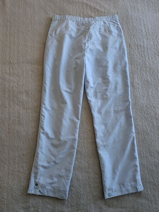Niebieskie spodnie sportowe dresowe ortalionowe dresy Ellesse 38