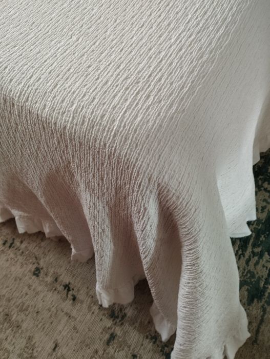 Coberta com folho duplo e almofadas