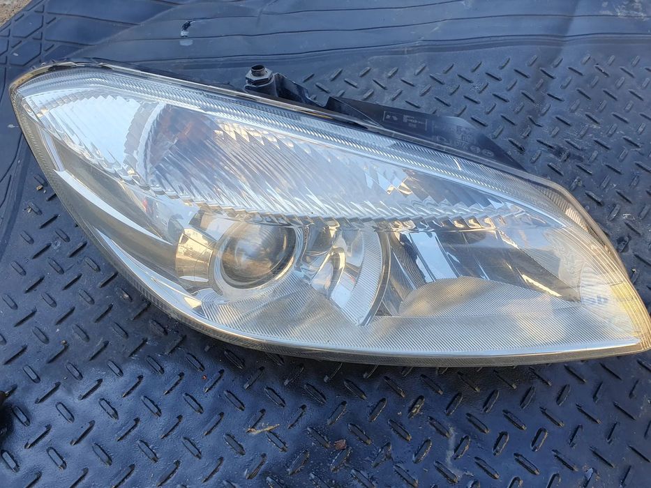SKODA ROOMSTER FABIA II LIFT LAMPA REFLEKTOR PRZÓD PRAWY EUROPA 173203 HELLA ORYGINAŁ