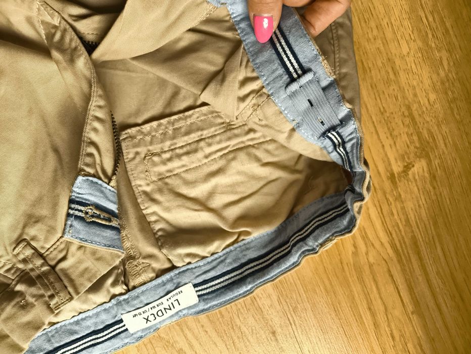 Kremowe eleganckie spodnie chłopięce Lindex, rozmiar 164