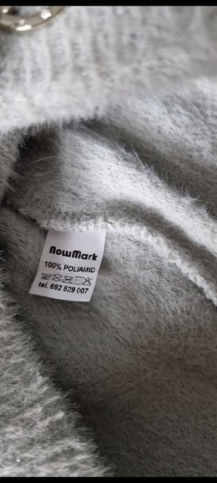 Modna zimowa czapka marki NowMark z pomponem
