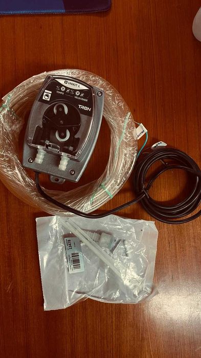 “Bomba peristáltica TRON UNIKIT-L 110/220V Nova – Ideal para lavandarias self-service”.